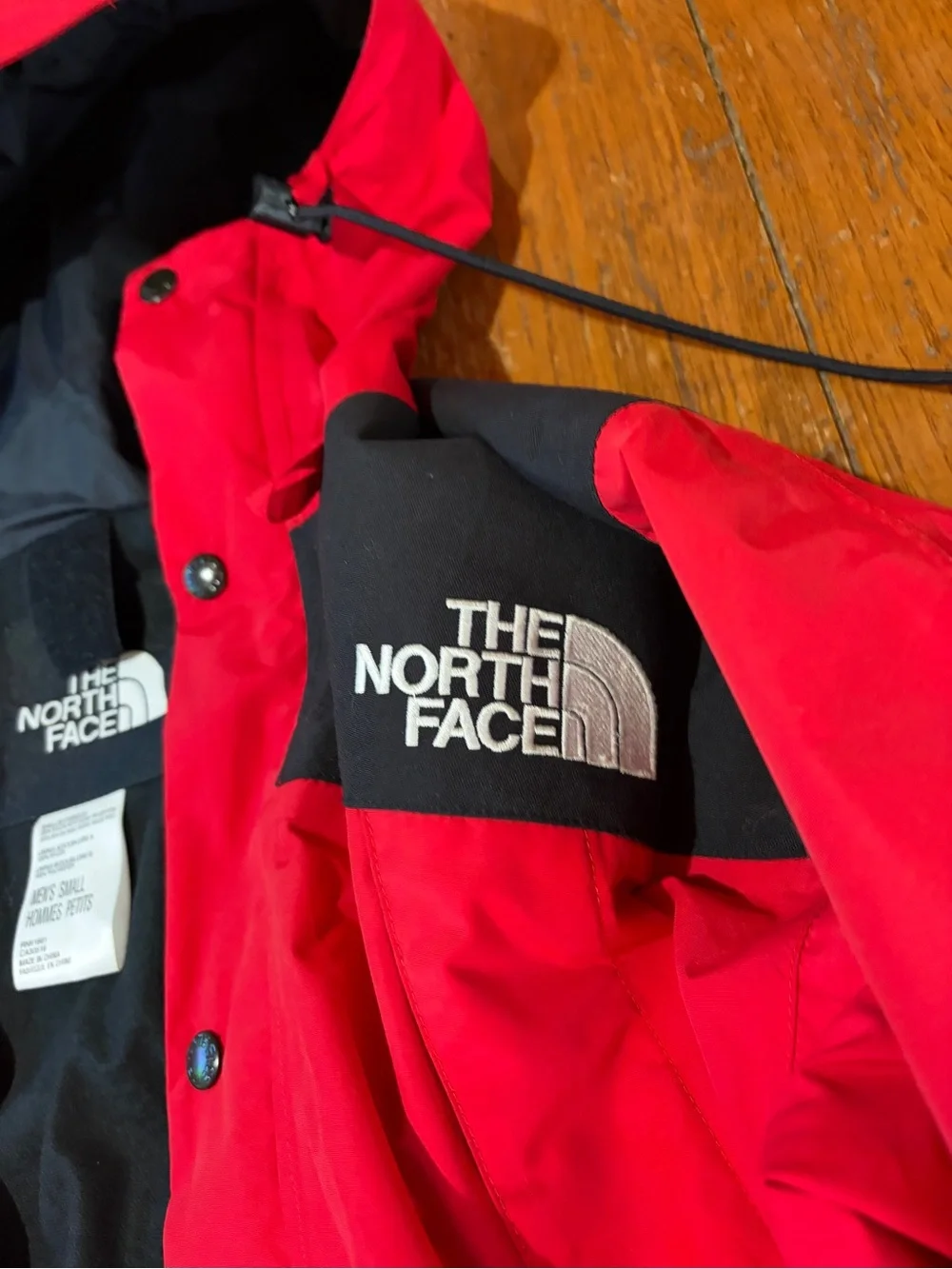 The North Face Red and Black Hooded Raincoat